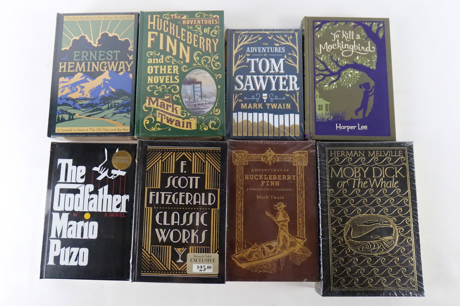 Lot of 8 American Classics Hardcover Books: Lot of 8 American Classics Hardcover Books. Including To Kill a Mockingbird, Moby Dick, The Godfather, F. Scott Fitzgerald Classic Works, The Adventures of Tom Sawyer, Ernest Hemingway, and The Advent
