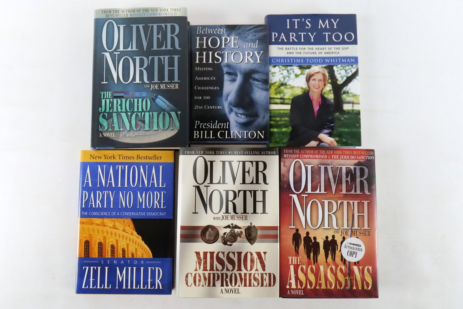 Lot of 6 Autographed Political and Military Hardcover Books: Lot of 6 Autographed Political Biographies and Military Fiction Hardcover Books. Including 3 x Oliver North (The Assassins, Mission Compromised and The Jericho Sanction), Zell Miller (A National Party