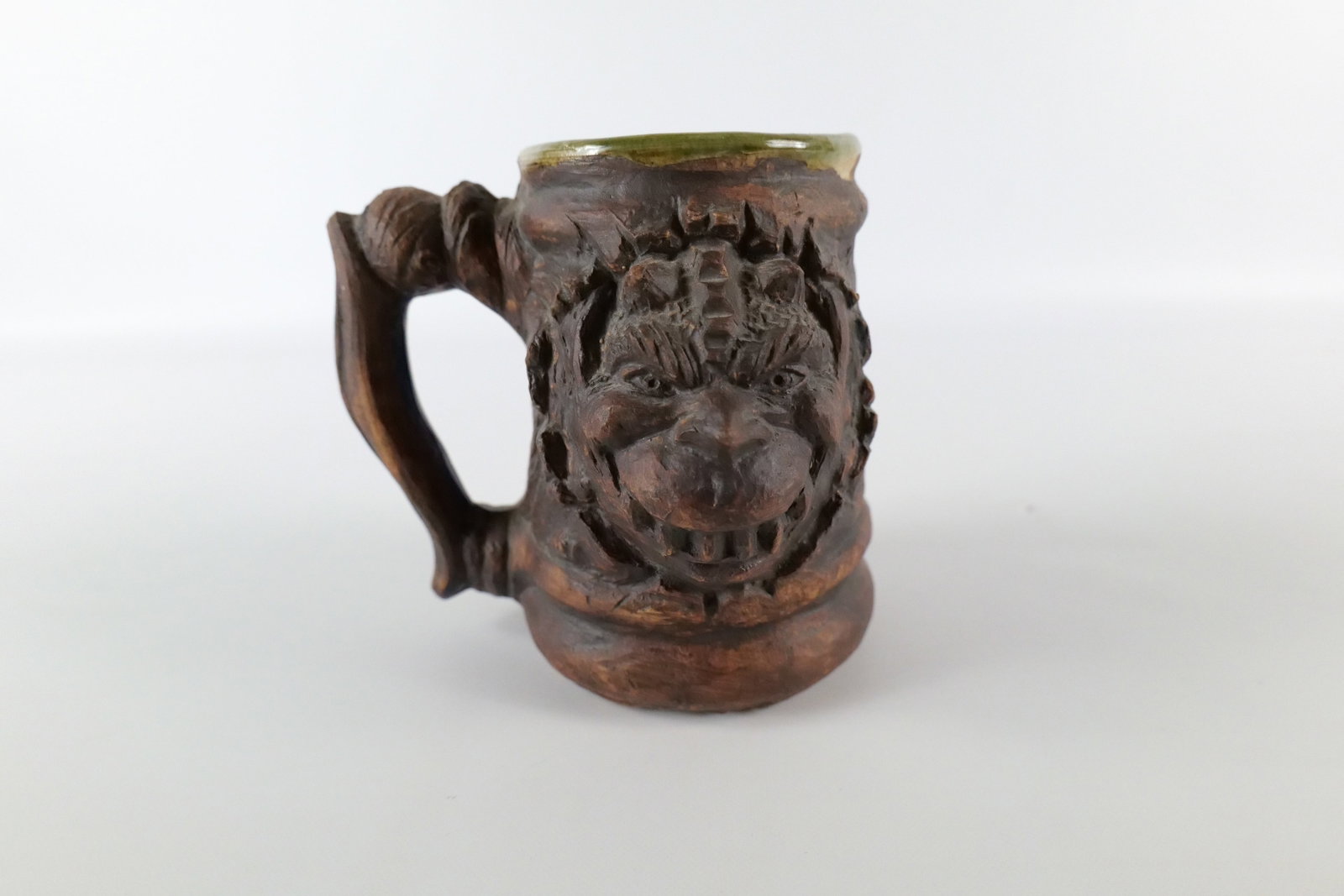 Tom Razooly Art Pottery Gargoyle Mug: Tom Razooly Art Pottery Gargoyle Mug. Measures 5" tall. All invoices must be paid within 24 hours of the sale. We offer multiple shipping options, please read the terms as they have changed. We also o