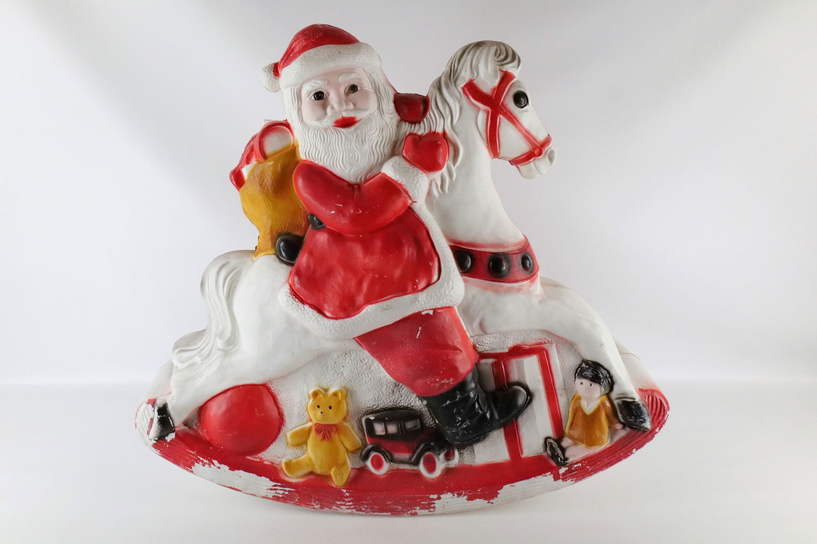 Vintage Don Featherstone Santa on Rocking Horse Blow Mold: Vintage Don Featherstone Santa on Rocking Horse Blow Mold. Some paint loss. Marked on Back - Featherstone. Missing Light Cord. Measures 30" tall x 34" long x 12" wide. All invoices must be paid within