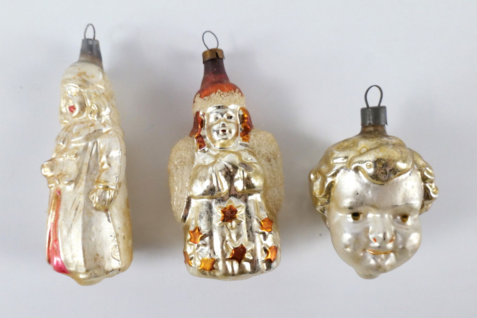 Lot of 3 Antique Mercury Glass Angel and Cherub Ornaments: Lot of 3 Antique Mercury Glass Angel and Cherub Ornaments. Including Kate Greenway - Missing Top Piece to hook attachment. Some paint loss. Largest measures 4" long. All invoices must be paid within 2