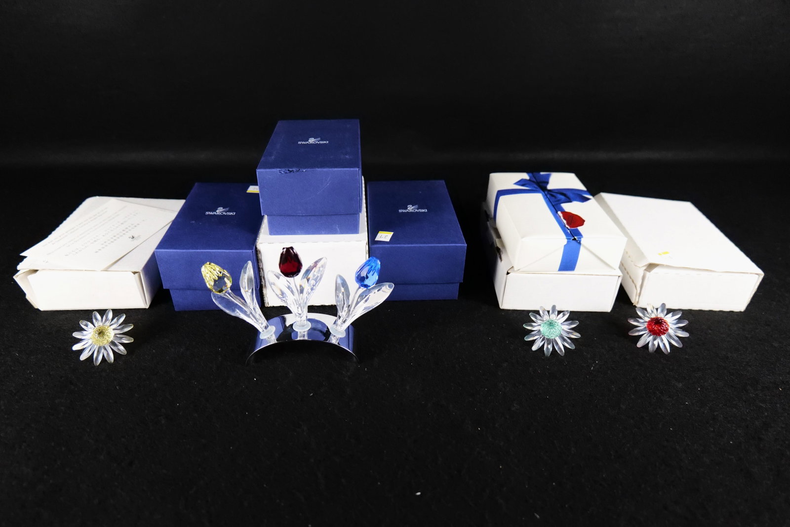 Lot of Swarovski SCS Membership Sets: Lot of Swarovski SCS Membership Sets. Including 3 Tulips with Stand, and 3 Colored Daisies. All invoices must be paid within 24 hours of the sale. We offer multiple shipping options, please read the t