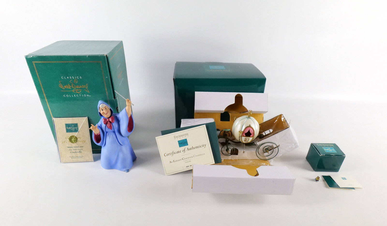 Lot of 3 WDCC Cinderella Figurines: Lot of 3 WDCC Cinderella Figurines. Including Bibbidi Bobbidi Boo - Fairy Godmother, An Elegant Coach for Cinderella, and Gus Miniature. Fairy Godmother measures approx. 9.25" tall. Gus miniature meas