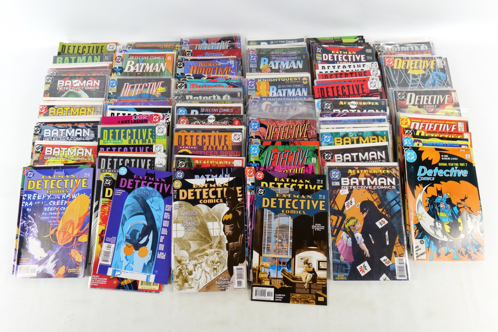 Lot of Detective Comics: Lot of Detective Comics. Including Vol. 1 #573-579, 0, 682-742, Batman TPB, Evolution, and 751-800. Average Grade is Fine to VF. Please note that the short boxes in photos do not come with the lot; th