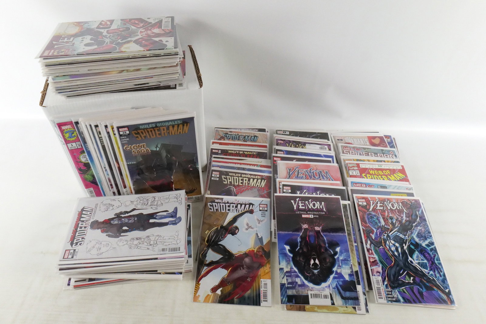 Short Box of Miles Morales and Friends Comics: Short Box of Miles Morales and Friends Comics. Including Venom, Miles Morales, and Web of Spiderman. Average Grade is VF to NM. Short Box is Full. Please note that the short boxes in photos do not com