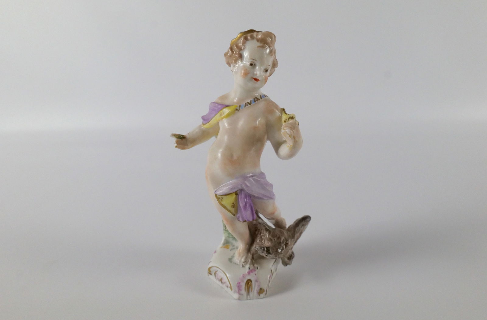 Antique KPM Porcelain Cherub Figurine: Antique KPM Porcelain Cherub Figurine. Hand Painted. Missing Wings, Missing Fingers on right hand, and Missing Fabric from other hand. Measures 4.75" tall. All invoices must be paid within 24 hours of