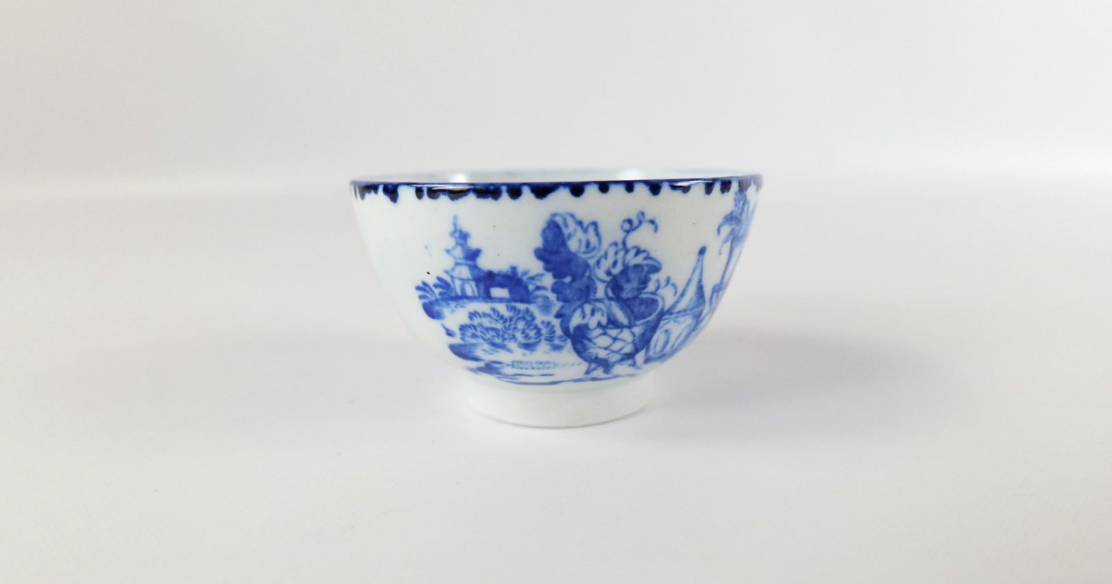 Chinese Export Hand Painted Porcelain Tea Bowl: Chinese Export Hand Painted Porcelain Tea Bowl. Blue Asian Scene Design. At least 19th Century or Earlier. Good Condition. Measures 2" tall x 3.25" wide. All invoices must be paid within 24 hours of t
