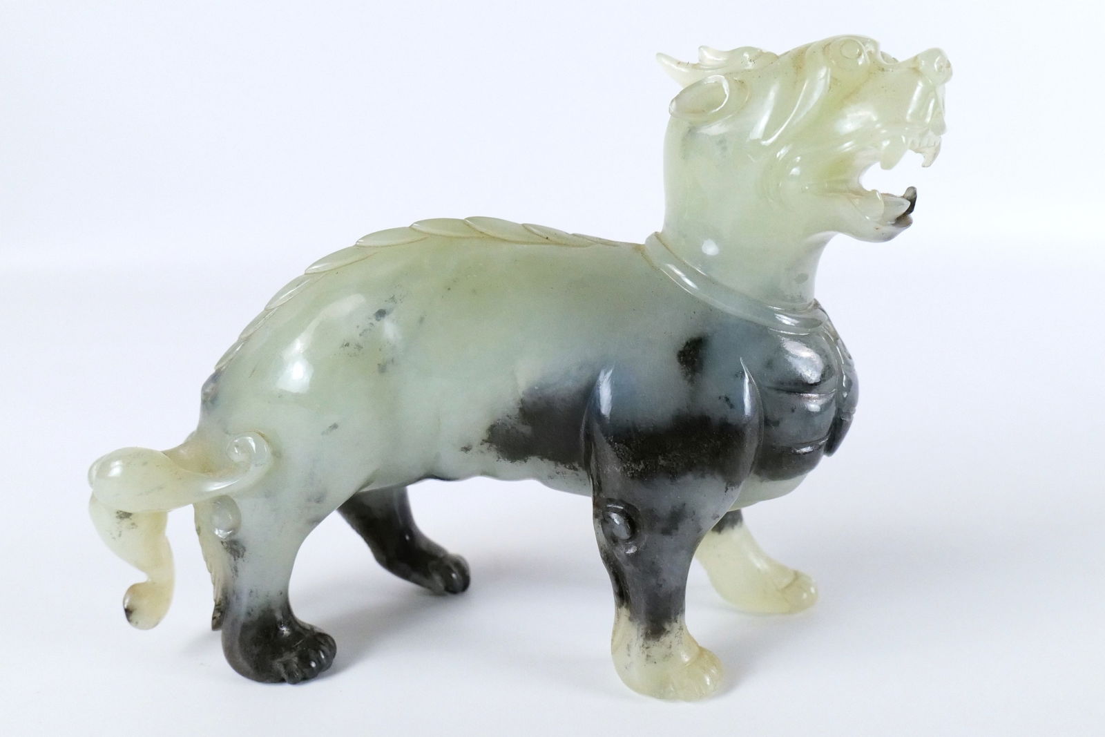 Jade Foo Dog/Imperial Lion Figurine: Jade Foo Dog/Imperial Lion Figurine. Good Condition. Measures 5.25" tall x 7" long. All invoices must be paid within 24 hours of the sale. We offer multiple shipping options, please read the shipping