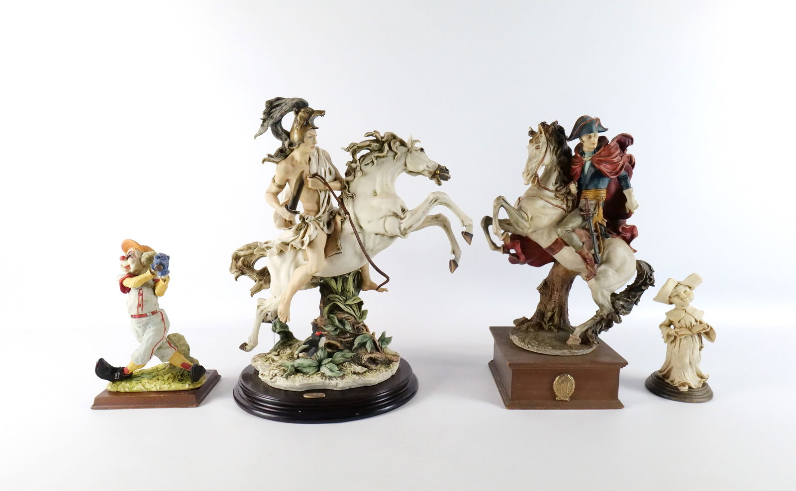 Group Lot of Figurines: Group Lot of Figurines. Including Capodimonte Napoleon on Horseback - Chip on red coat, Armani Figurine - Knight on Horseback AP/3000 - Sword has been reglued and leather is disintegrated, Resin Figur