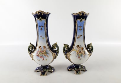 Pair of French Majolica Double Handled Vases with Cherubs