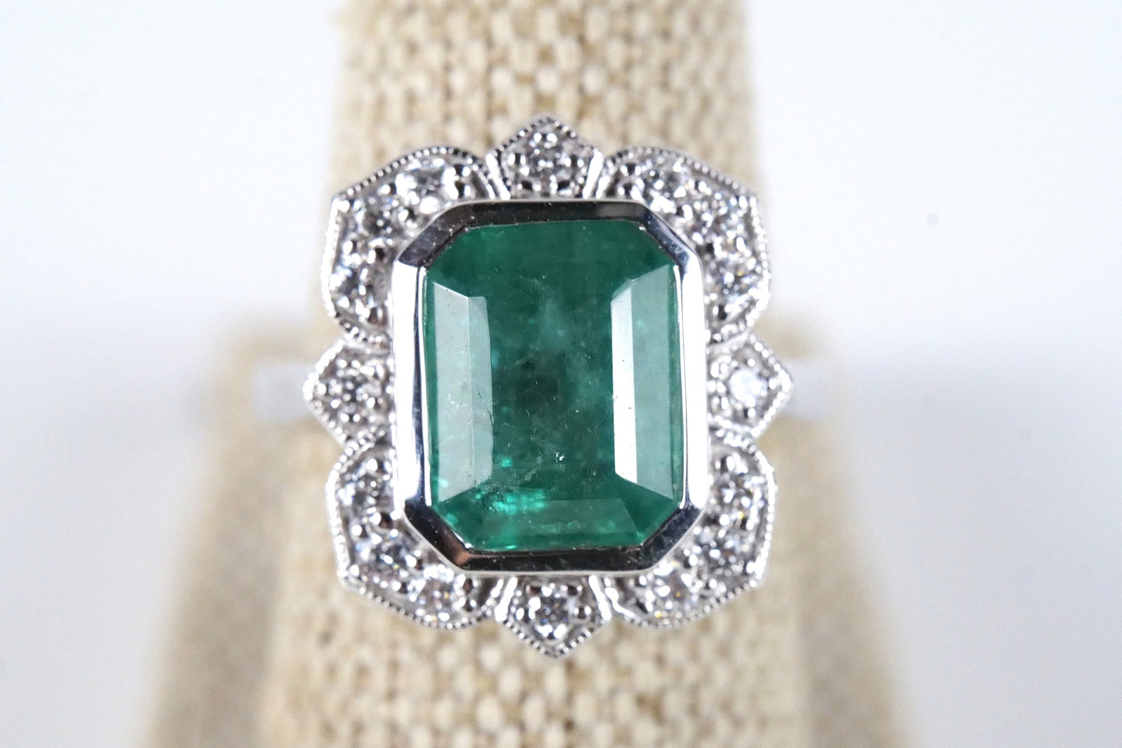 Platinum Emerald and Diamond Ring: Platinum Emerald and Diamond Ring. Emerald weight is 4.54 carats. Diamond weight is .44 carats - 16 Pieces. Total weight is 9.3 grams. Ring Size 7. Comes with a GGA Report. All invoices must be paid w