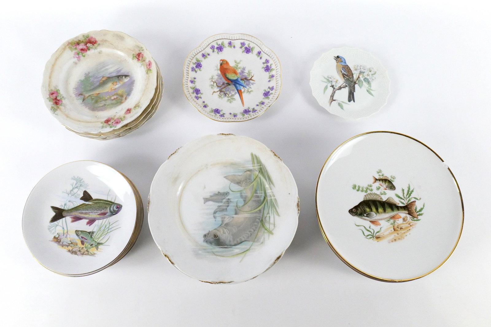 Group Lot of Fish and Bird Plates: Group Lot of Fish and Bird Plates. Including Set of 6 Kahla Germany 7.5" plates, Set of 5 J.K. Germany 9.75" Fish Dinner Plates - One with large chip on rim, Set of 4 L.S&S Austria 8.5" Plates - Need