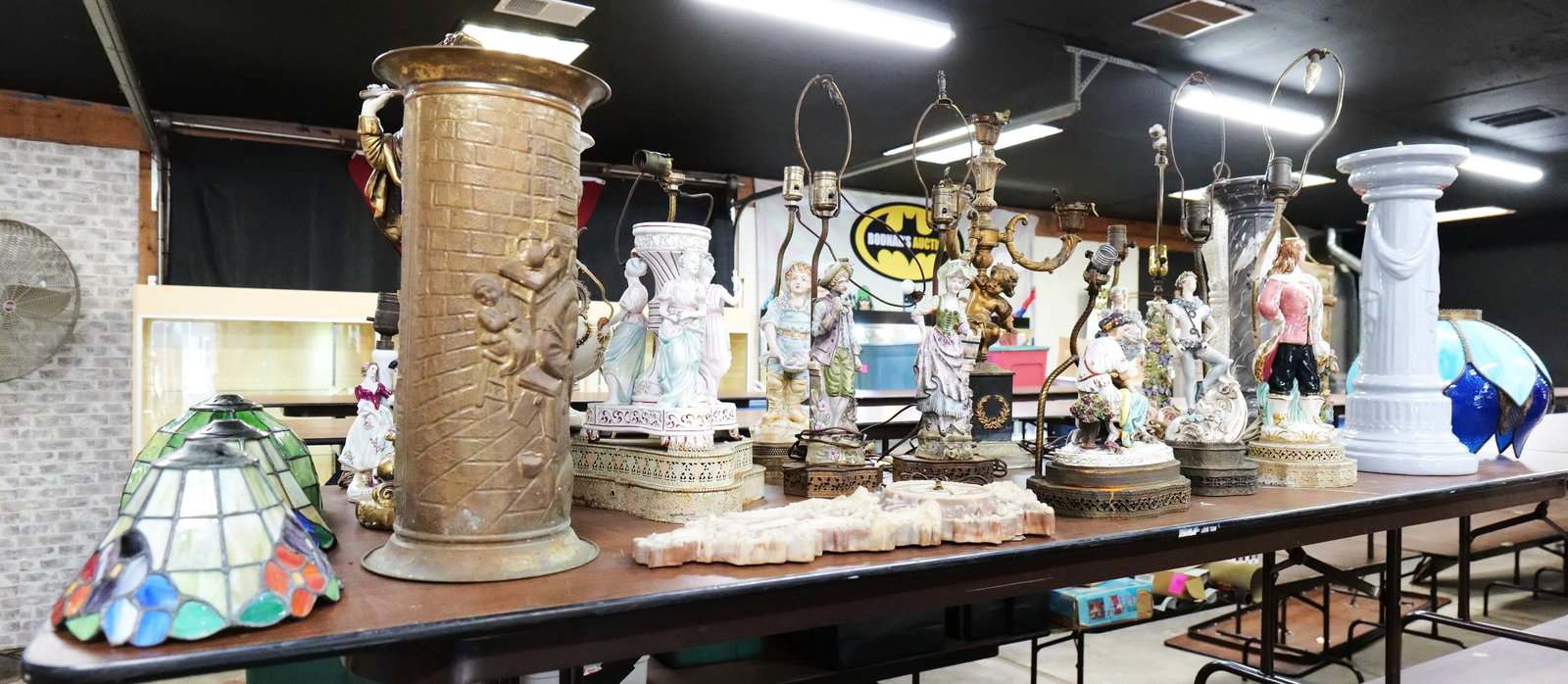 8 Foot Table Lot: 8 Foot Table Lot!!!!!!!! Including Porcelain and Bisque Lamps, Columns, Incolay Clock, Brass Umbrella Stand, Various Shades and More. Some pieces AS-IS. LOCAL PICK UP is recommended for this lot. All