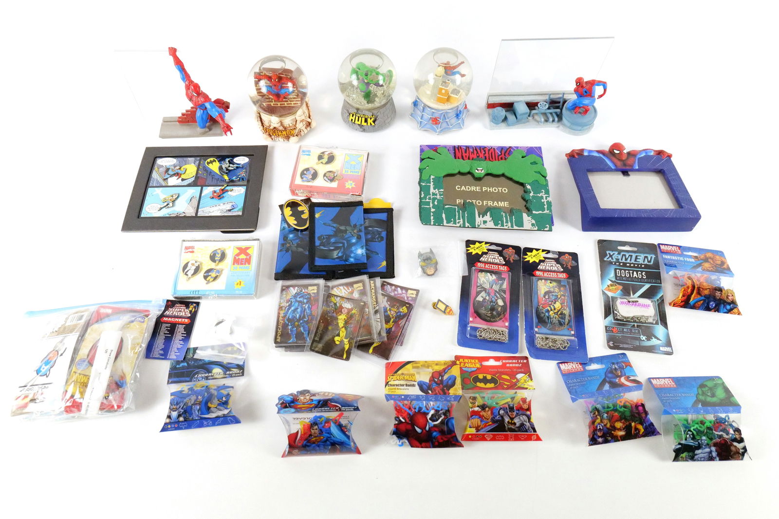 Lot of Comics Collectibles - Mostly Marvel and Some DC: Lot of Comics Collectibles - Mostly Marvel and Some DC. Including Picture Frames, Character Bands, Snow Globes, Wallets, Pin Sets, and More. All invoices must be paid within 24 hours of the sale. We o