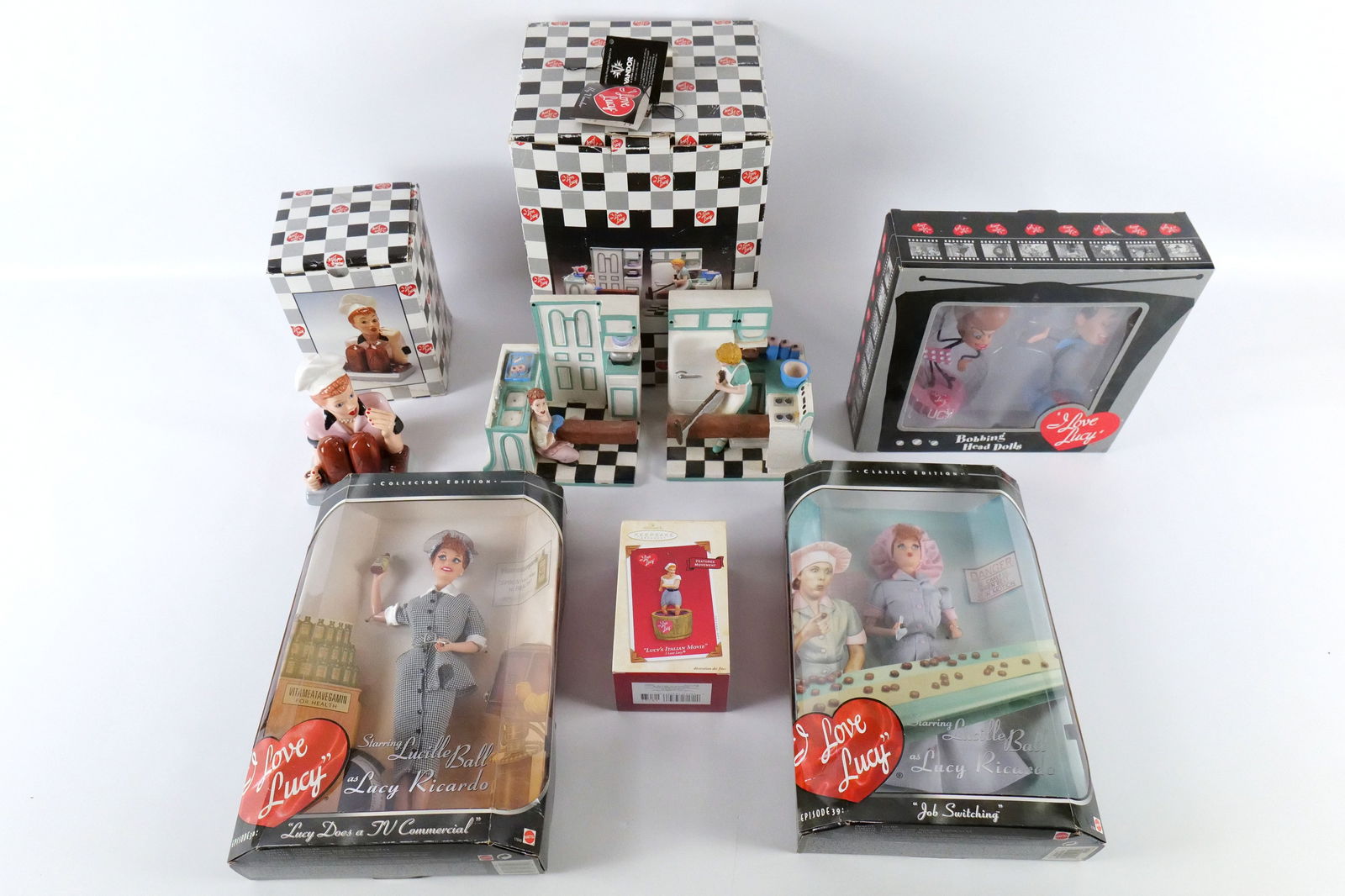 Lot of I Love Lucy Collectibles: Lot of I Love Lucy Collectibles. Including Barbies: Job Switching and Lucy Does a TV Commercial, Bobbing Head Dolls, Vandor Salt and Pepper Shaker, and Vandor AS-IS Bookends - Broken Pieces and Crazin