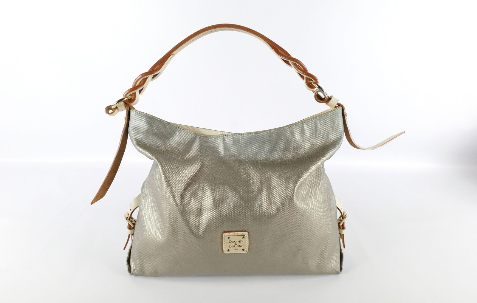 Dooney & Bourke Metallic Hobo Bag: Dooney & Bourke Metallic Hobo Bag. Used Condition. Some wear to straps. Measures 15" x 16". All invoices must be paid within 24 hours of the sale. We offer multiple shipping options, please read the t
