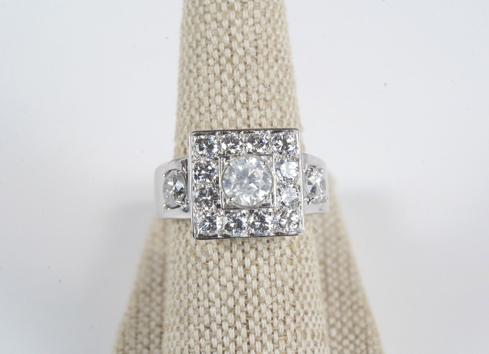 Platinum Diamond Ring: Platinum Diamond Ring. Contains Center Stone weighing .93 carat and 14 round diamonds weighing approx. 2.00 carats. Total Ring Weight is 11.8 grams. Ring Size 7.5. Comes with AIGL and EGL Report. All