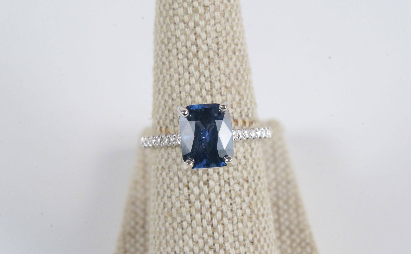 18K White Gold Spinel & Diamond Ring: 18K White Gold Spinel & Diamond Ring. Contains Spinel Stone weighing 3.28 carats and 16 round diamonds weighing .16 carats. Total Ring Weight is 3.9 grams. Ring Size 6.5. Comes with AIGL and GIA Repor