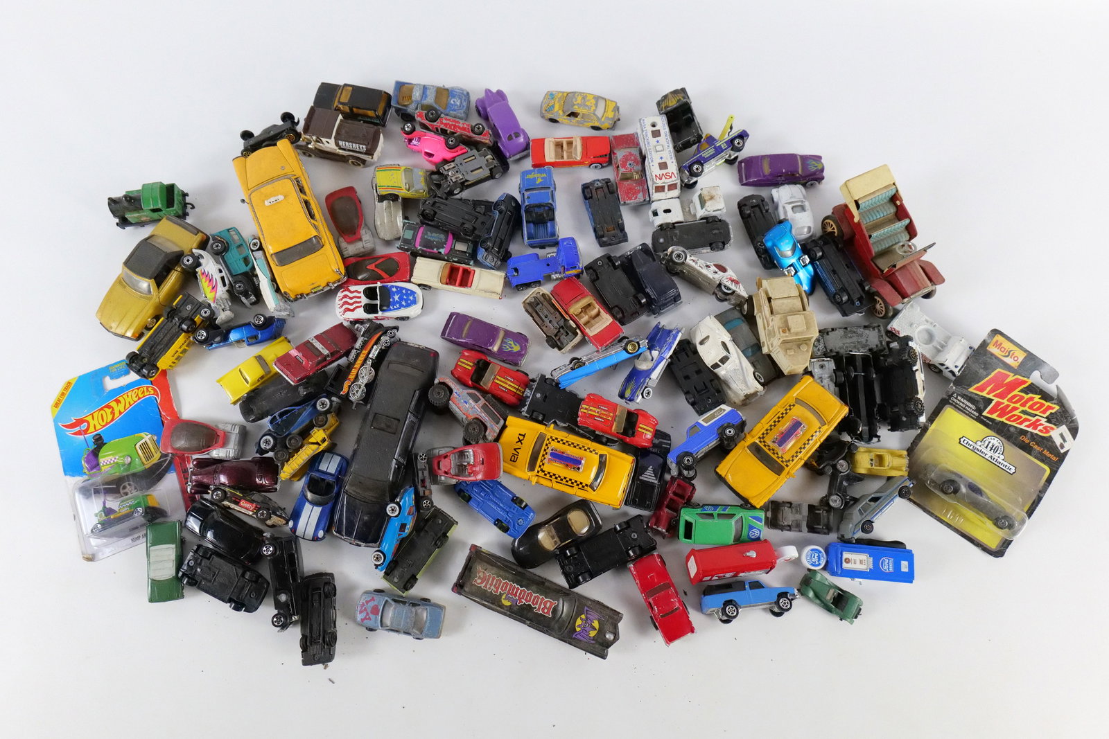 Lot of Mostly Diecast and Some Plastic Vehicles: Lot of Mostly Diecast and Some Plastic Vehicles. Including Hot Wheels, Ertl, Majorette, Matchbox, Maisto, and More. Used Condition - Paint Wear, Scratching, Etc. All invoices must be paid within 24 ho