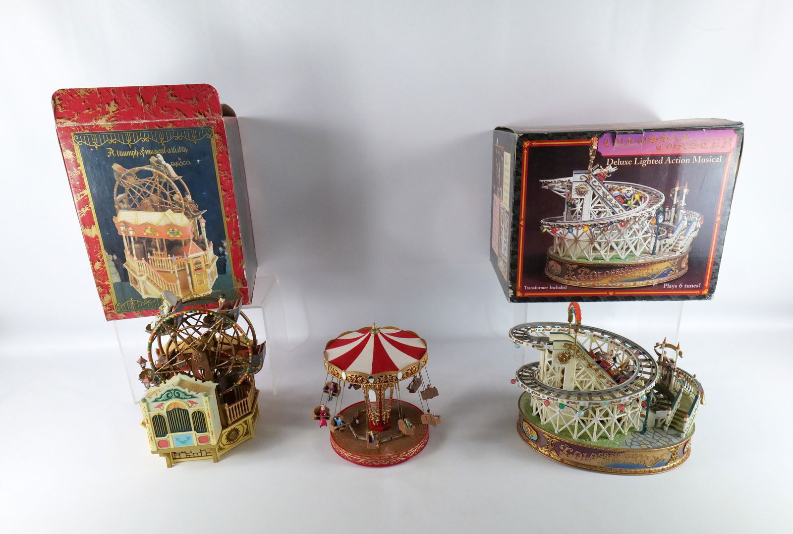 Group Lot of Amusement Ride Animated Pieces: Group Lot of Amusement Ride Animated Pieces. Lot includes Colossal Coaster with Box - No cord Untested, Enesco The Majestic Ferris Wheel with Box - Tested and Working - No Cord, and Battery Operated S