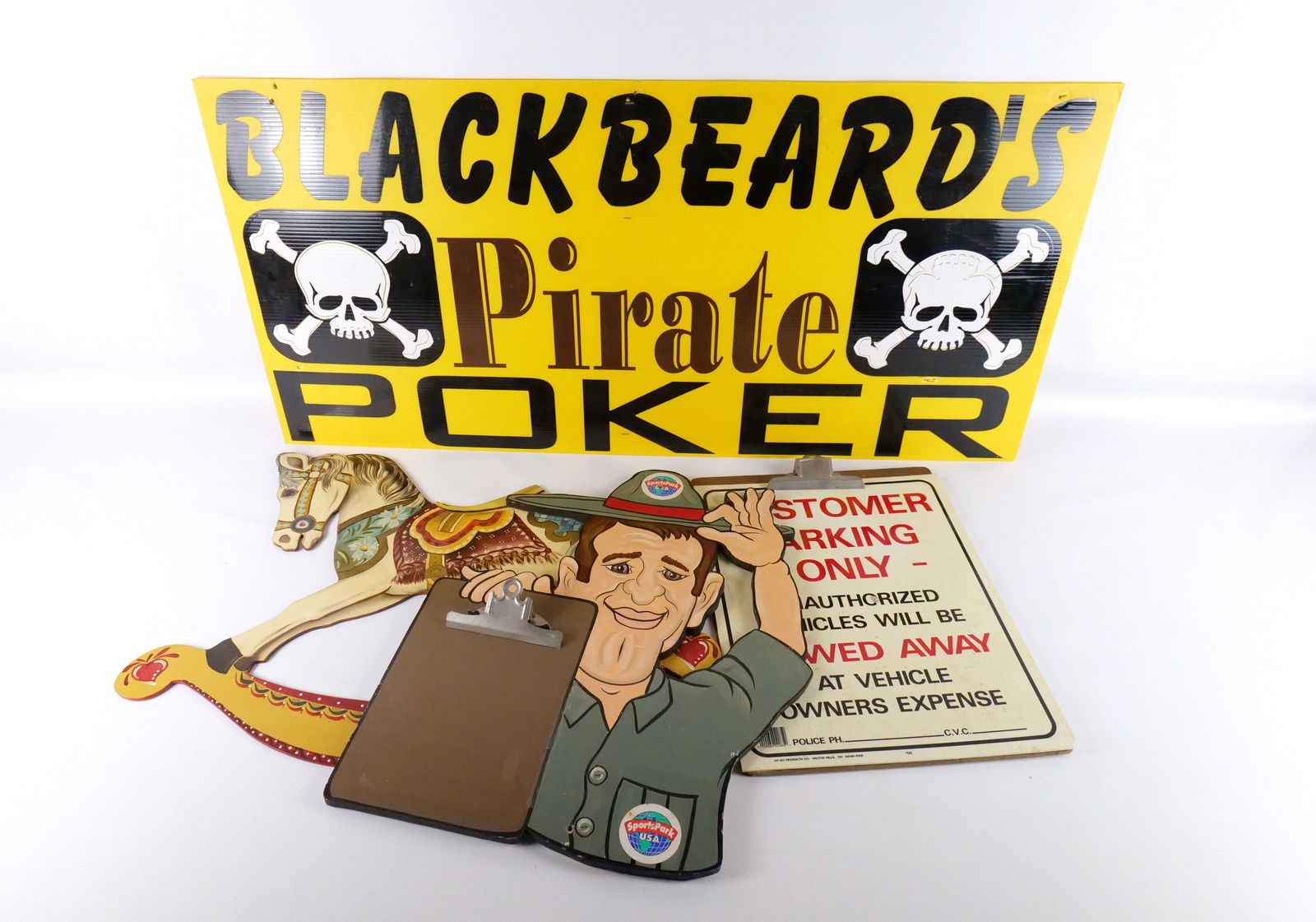 Lot of Miscellaneous Wall Hanging Signs: Lot of Miscellaneous Wall Hanging Signs. Including Customer Parking Only Plastic Sign on Large Clipboard - Damage on corner and some staining, SportsPark USA Wooden Hanging Ranger with Clipboard - Som