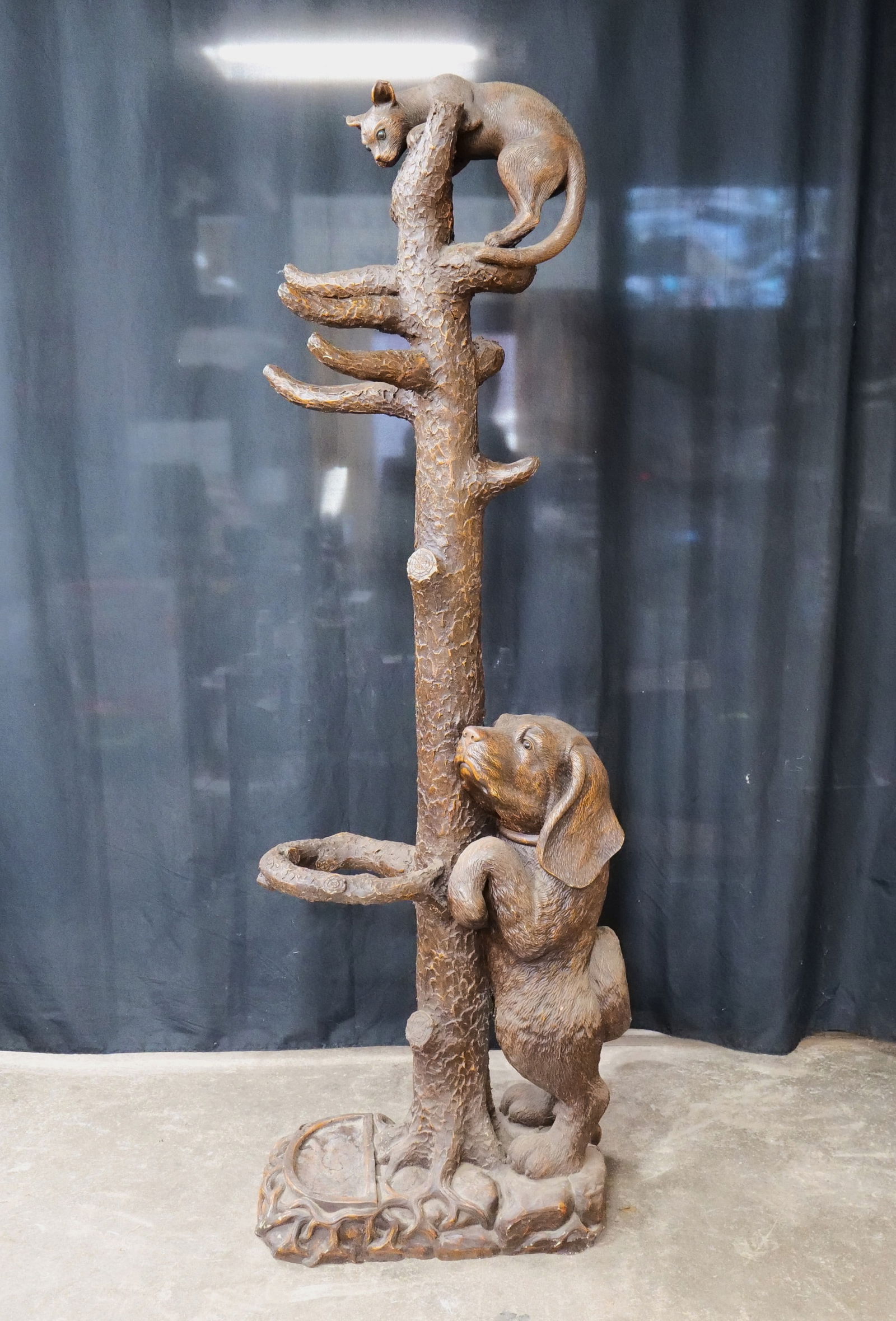 Rustic Coat Rack/Umbrella Stand with Figural Tree and Animals: Resin Rustic Coat Rack/Umbrella Stand with Figural Tree and Animals. Features Cat and Dog. Measures 78" tall x 29" wide x 17" deep. All invoices must be paid within 24 hours of the sale. We offer