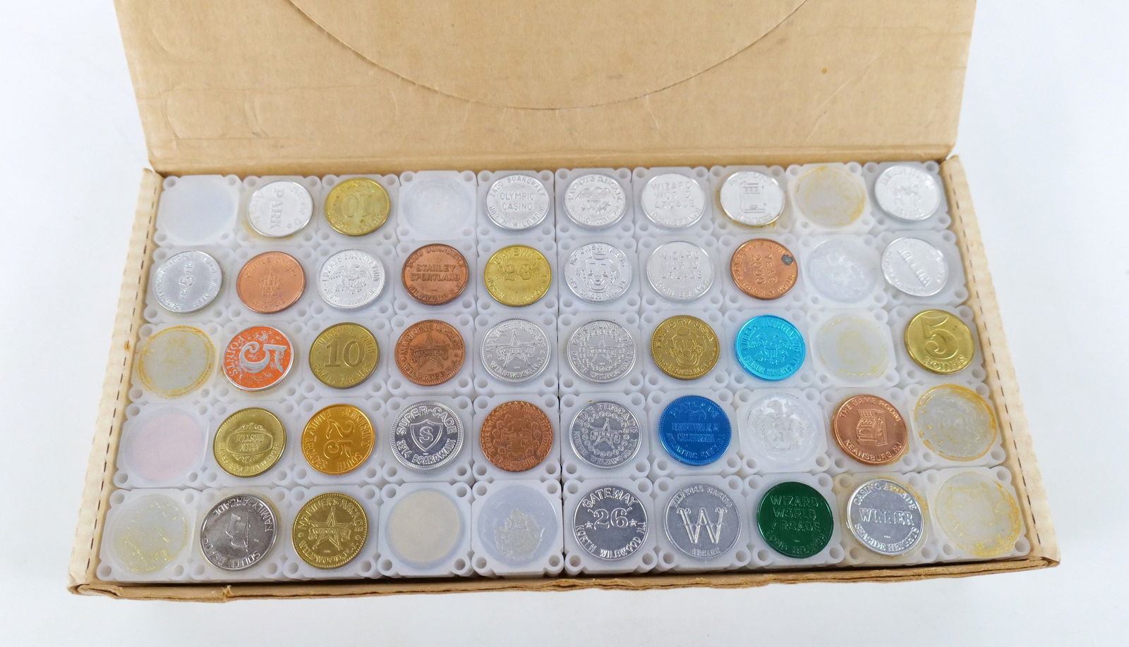 Group Lot of Tokens and Coin Tubes: Group Lot of Tokens and Coin Tubes. Comes with original Coin Tube Box. Including Supercade, Lucky's Fascination, Olympic Casino, Wizard World Arcade, Game Room and More. All invoices must be paid