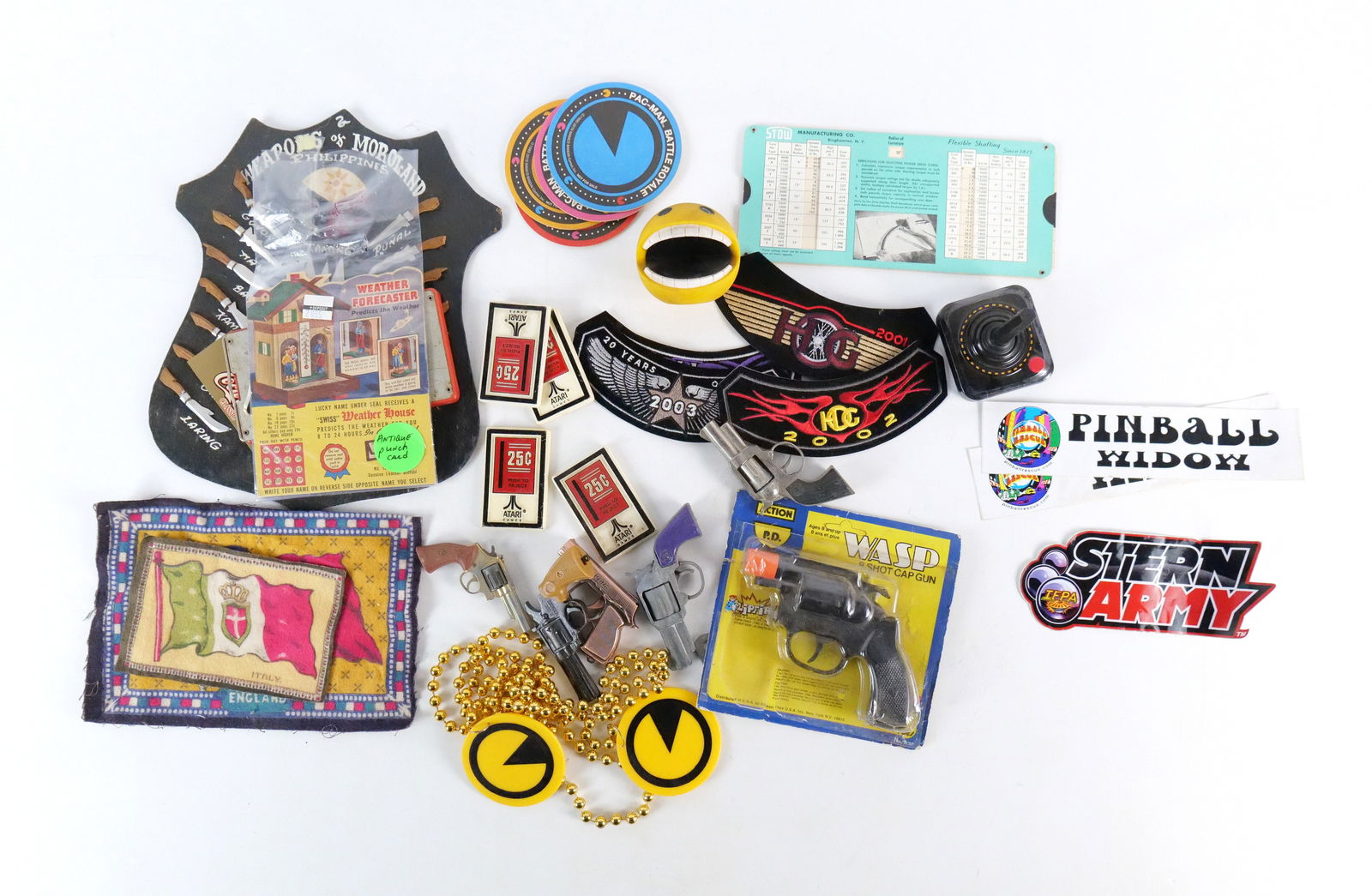 Lot of Assorted Amusement and Gaming Items: Lot of Assorted Amusement and Gaming Items. Including Atari Magnets, Pac Man Necklace, Pac-Man Ball, Pac-Man Battle Royale Coasters, Cap Guns, Patches, Pinball Stickers and More. All invoices must be