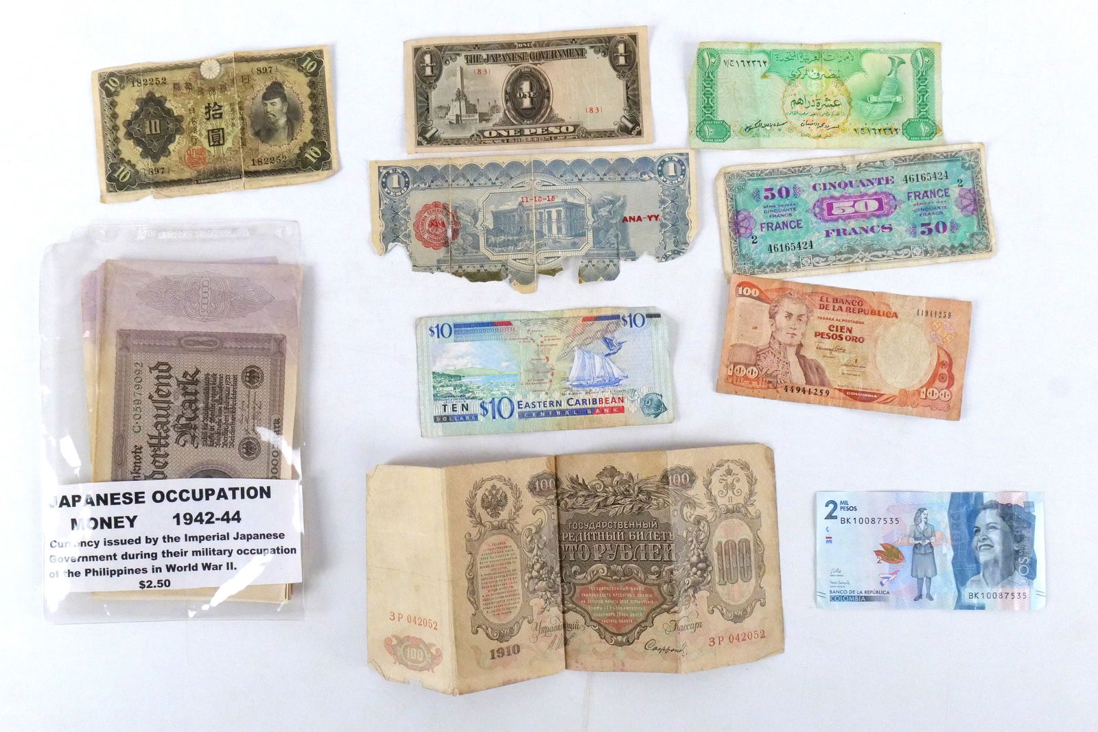 Group Lot of Foreign Paper Money: Group Lot of Foreign Paper Money. Including Eastern Caribbean, Columbia, Japanese and More. All invoices must be paid within 24 hours of the sale. We offer multiple shipping options, please read the s