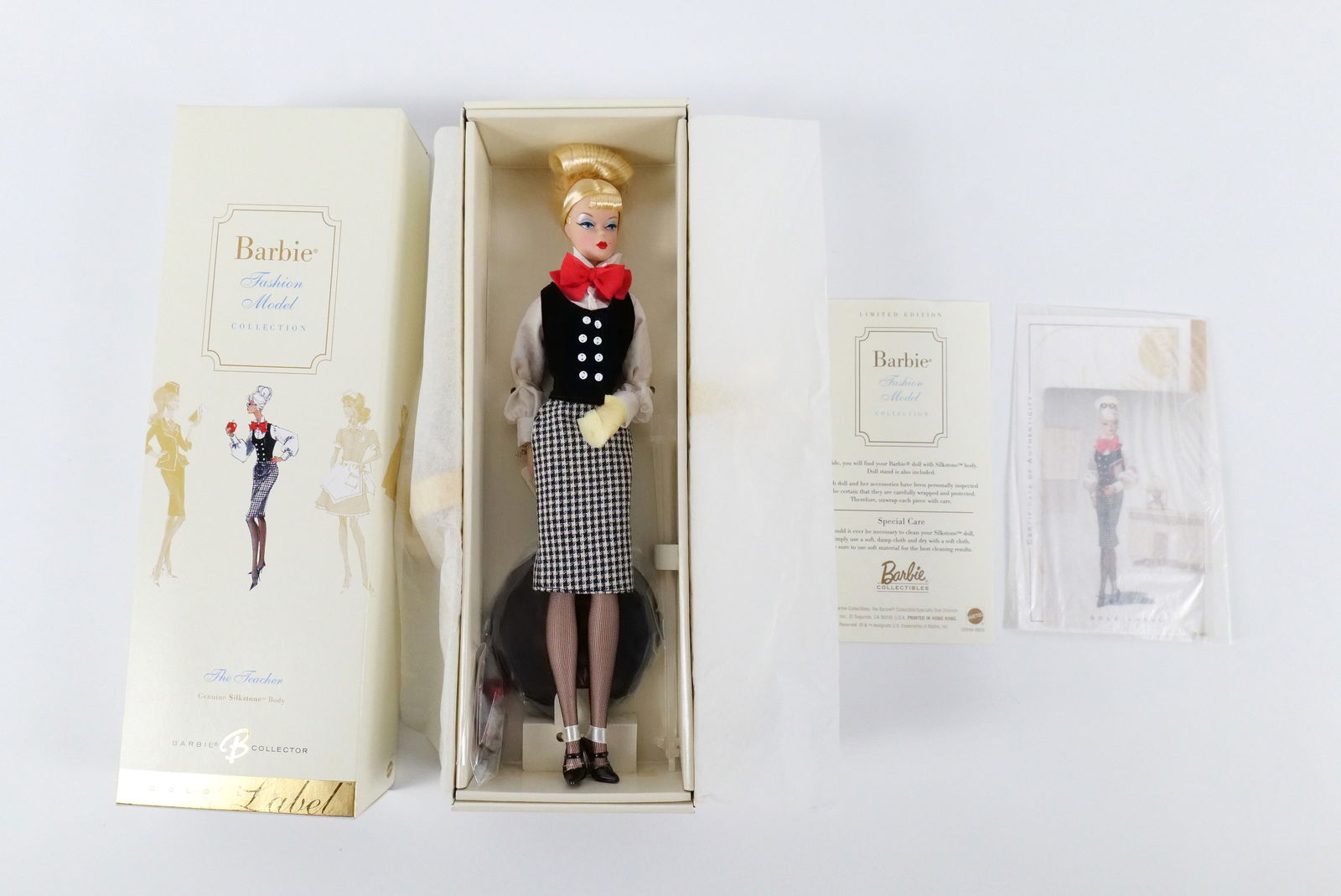The Teacher Silkstone Gold Label Barbie Doll: The Teacher Silkstone Gold Label Barbie Doll - Fashion Model Collection. New in Box. All invoices must be paid within 24 hours of the sale. We offer multiple shipping options, please read the shipping