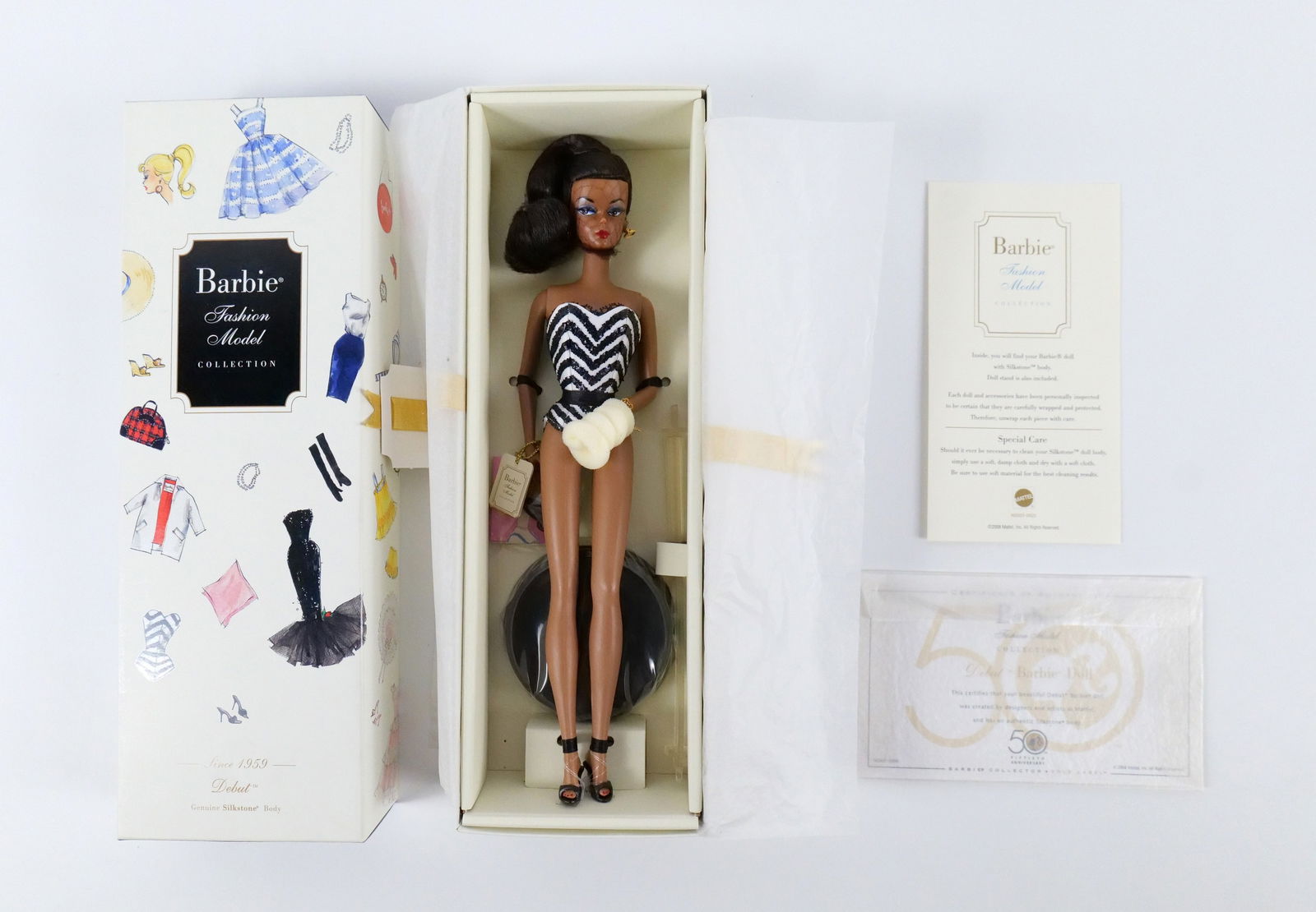 Debut Silkstone 50th Anniversary Barbie Doll - AA Version: Debut Silkstone 50th Anniversary Barbie Doll - Fashion Model Collection - Since 1959 - AA Version - Limited Edition. New in Box. All invoices must be paid within 24 hours of the sale. We offer multipl