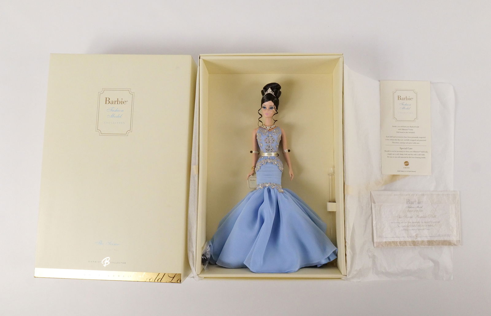 The Soiree Silkstone Gold Label Barbie Doll: The Soiree Silkstone Gold Label Barbie Doll - Fashion Model Collection. New in Box. All invoices must be paid within 24 hours of the sale. We offer multiple shipping options, please read the shipping