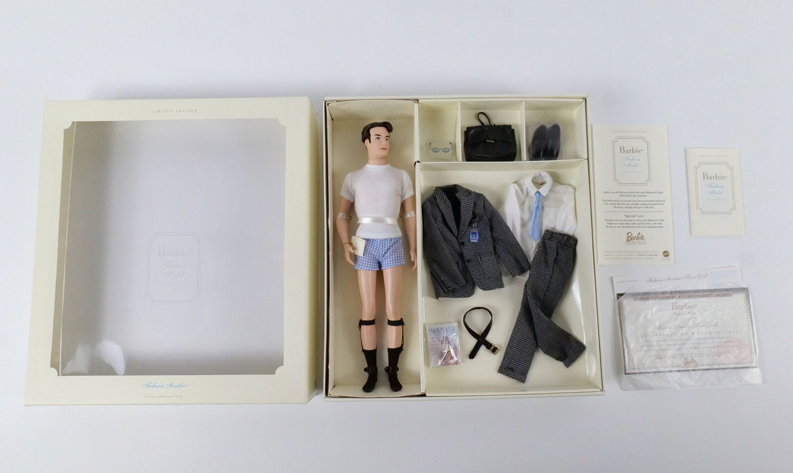Fashion Insider Ken Giftset - Limited Edition Silkstone Ken Doll with Accessories: Fashion Insider Ken Giftset - Limited Edition Silkstone Ken Doll with Accessories - Fashion Model Collection. New in Box. Bottom edge of box does have minor denting. All invoices must be paid within