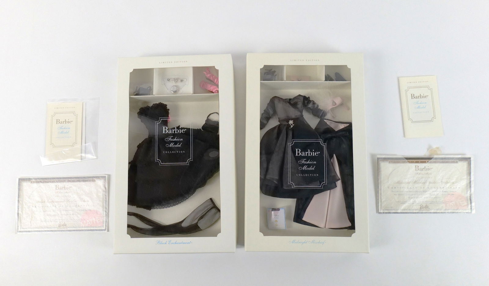 Lot of 2 Barbie Fashion Model Collection Limited Edition Outfits: Lot of 2 Barbie Fashion Model Collection Limited Edition Outfits. Including Black Enchantment and Midnight Mischief. Made especially for the Silkstone Barbie Doll Body - Not for use with other