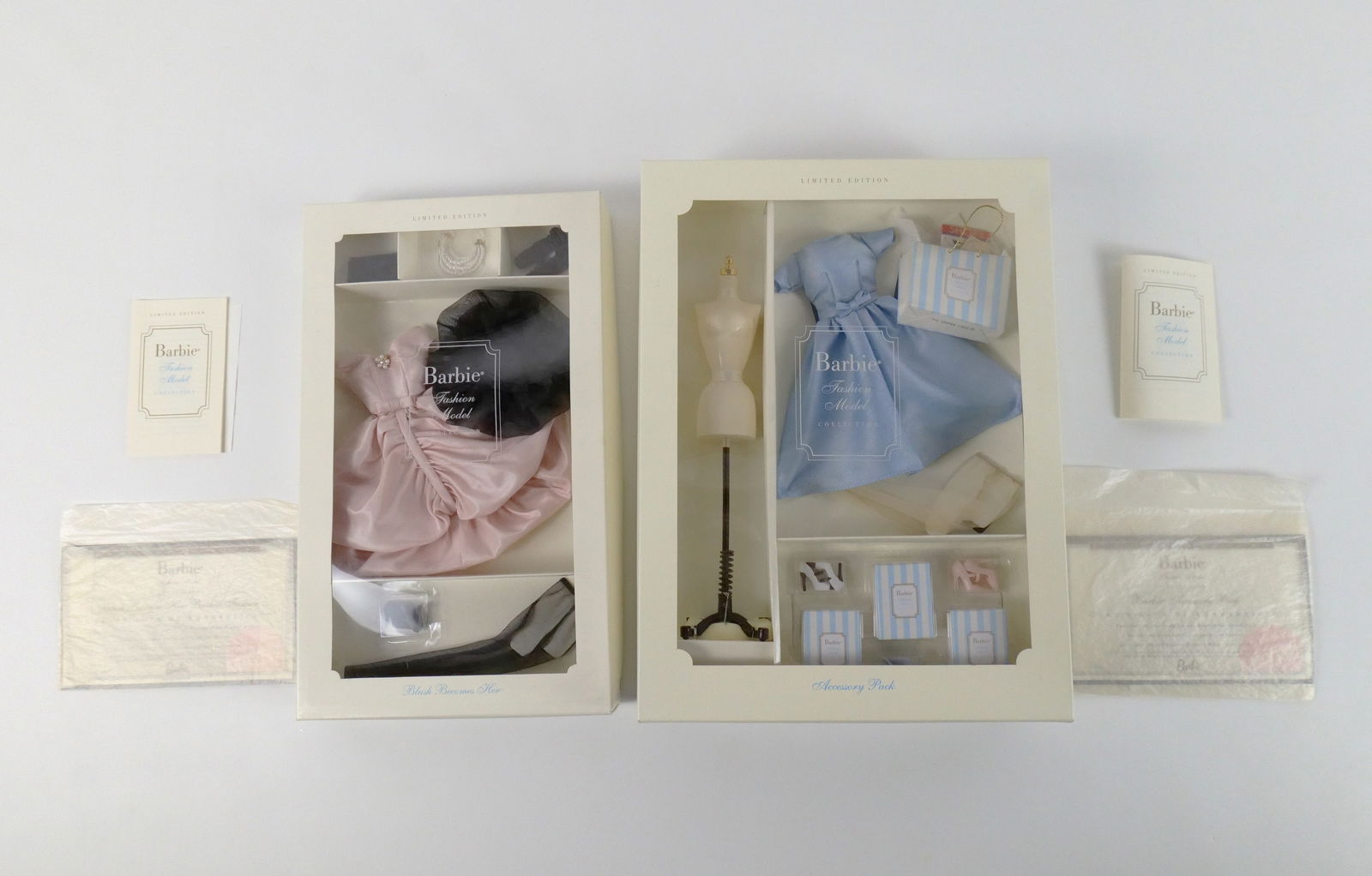 Lot of 2 Barbie Fashion Model Collection Limited Edition Items: Lot of 2 Barbie Fashion Model Collection Limited Edition Items. Including Blush Becomes Her Outfit and Barbie Accessory Pack. Made especially for the Silkstone Barbie Doll Body - Not for use with