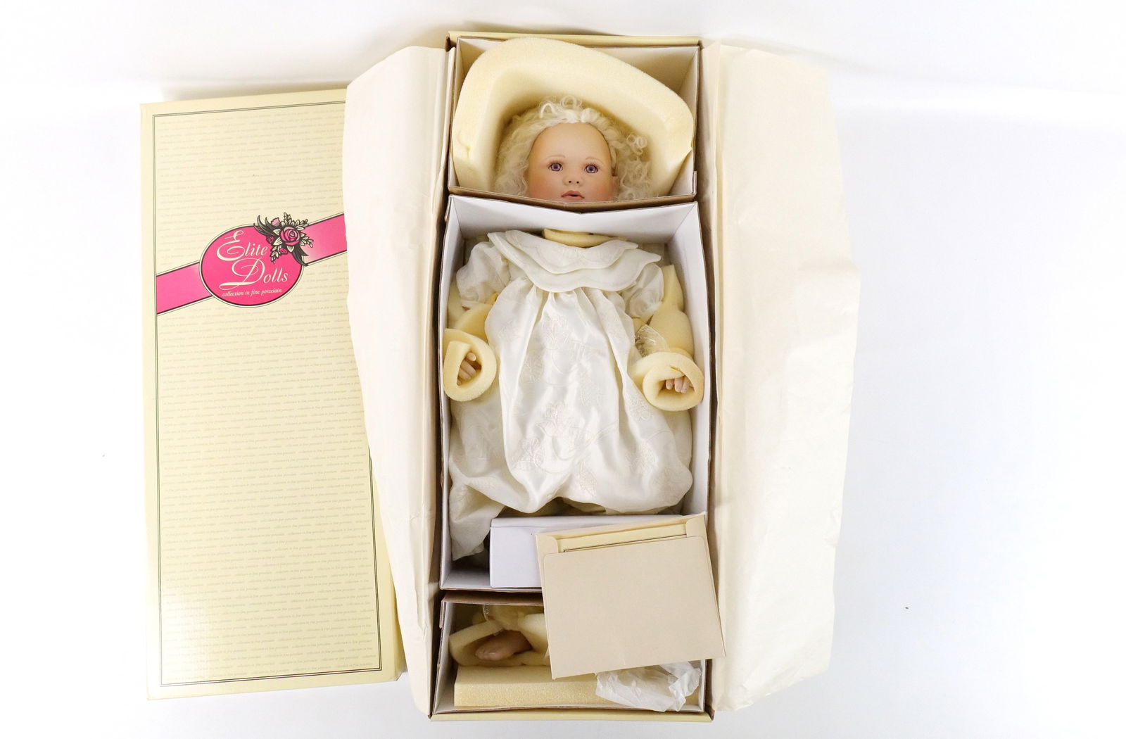 Elite Dolls Christine Orange Angel Porcelain Doll: Elite Dolls Christine Orange Angel Porcelain Doll. Appears to be in New condition in original box. Measures approx. 25" long. All invoices must be paid within 24 hours of the sale. We offer multiple s