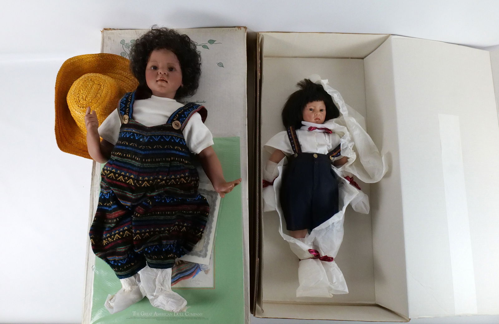 Lot of 2 Great American Doll Company Dolls: Lot of 2 Great American Doll Company Dolls. Including Puyi and Ricardo. Ricardo comes with just a shipper. Puyi comes with his box and shipper. Ricardo needs a cleaning as he has paper stuck to him in