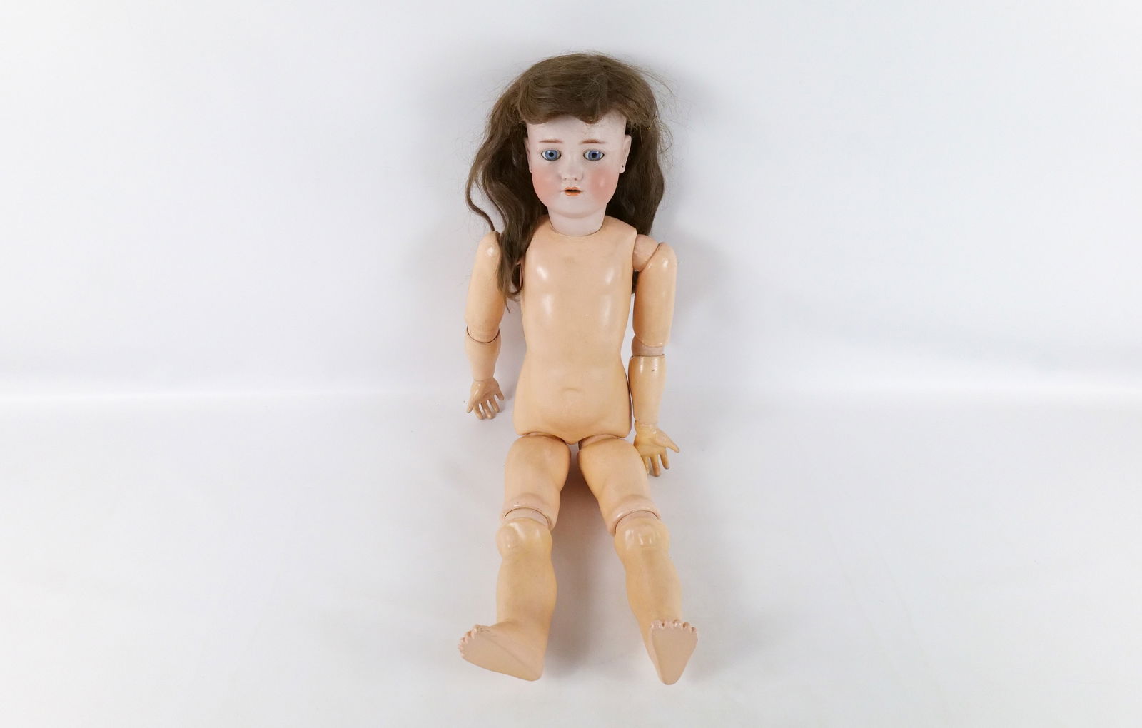 Antique German Heinrich Handwerck Simon Halbig Doll: Antique German Heinrich Handwerck Simon Halbig Doll. Bisque Head and Composition Jointed Body. Measures 29.5" long. All invoices must be paid within 24 hours of the sale. We offer multiple shipping