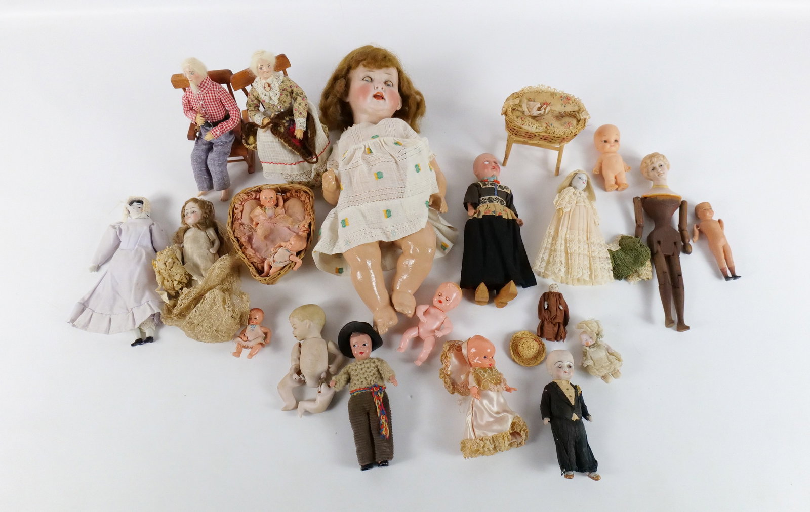 Lot of Antique to Contemporary Dolls: Lot of Antique to Contemporary Dolls. Various Types. Including Celluloid, Composition, Bisque, and Resin. Some heads marked Germany. Some dolls AS-IS. All invoices must be paid within 24 hours of the