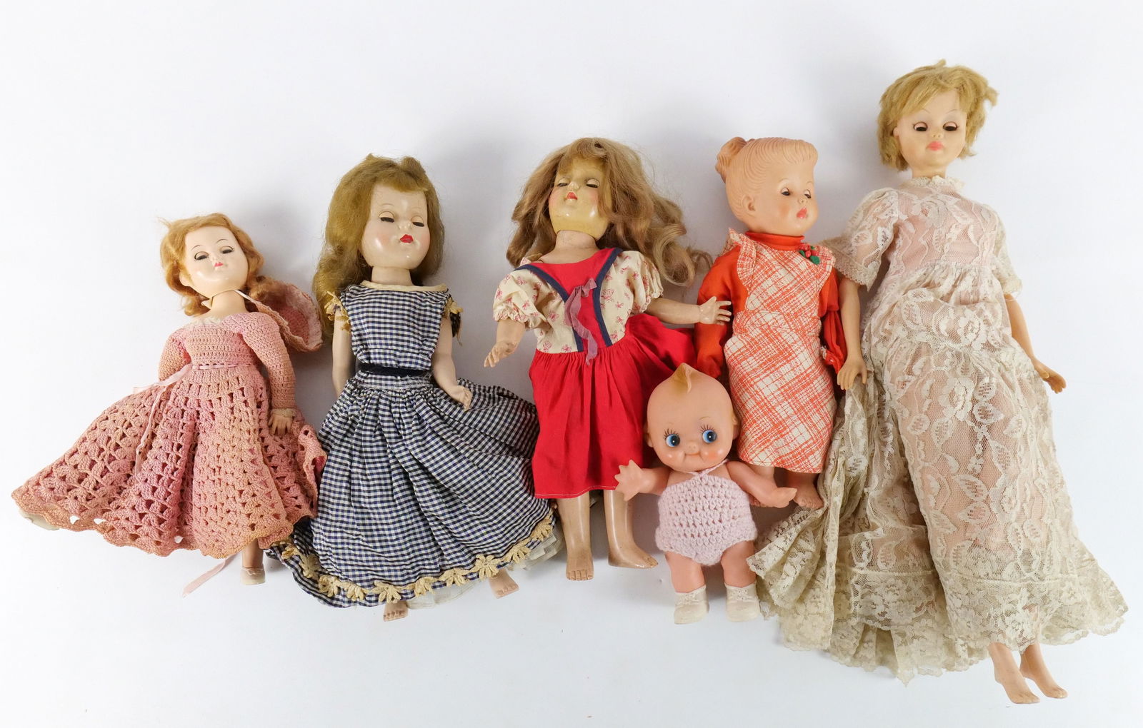 Lot of Vintage Plastic and Vinyl Dolls: Lot of Vintage Plastic and Vinyl Dolls. Including 1961 Kay Sam Fashion Doll, Ideal Hard Plastic Toni Doll, Plastic Kewpie, and More. Some dolls AS-IS. All invoices must be paid within 24 hours of the