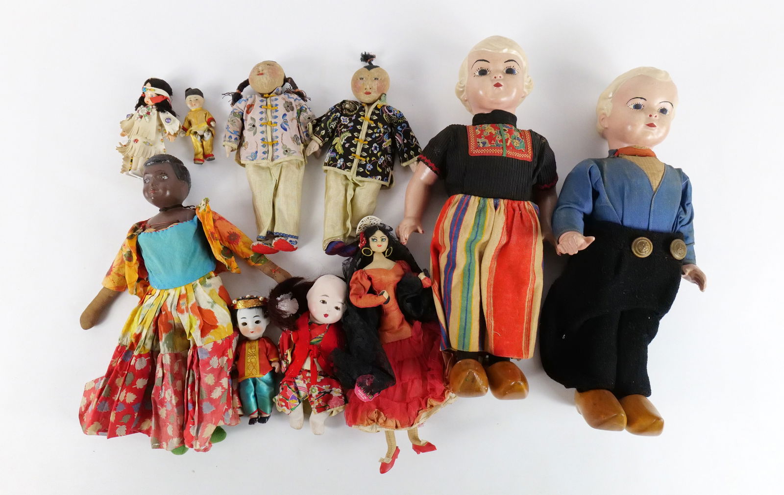 Lot of Vintage World Dolls: Lot of Vintage World Dolls. Many Asian Dolls, Dutch Composition, African, and More. Includes Cloth, Porcelain, Composition, and Plastic. Some dolls AS-IS. All invoices must be paid within 24 hours of