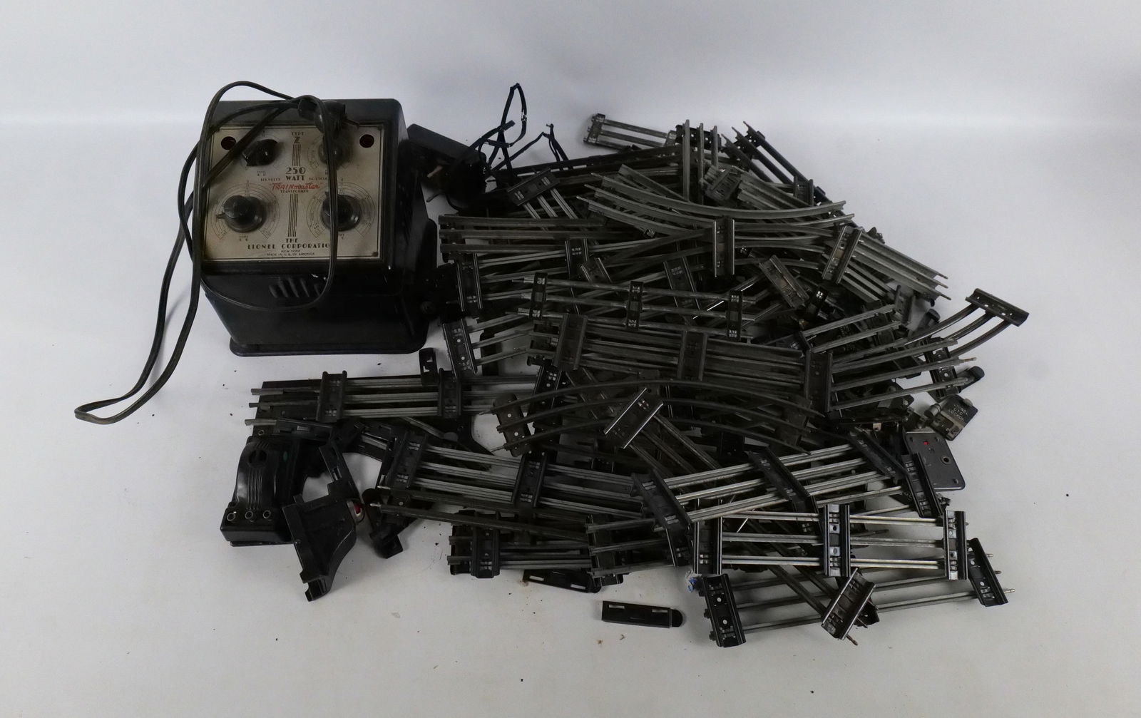 Group lot of Lionel 027 gauge train tubular track: Group lot of Lionel 027 gauge train tubular track including strait and curve track, switch track and a type Z transformer untested. All invoices must be paid within 24 hours of the sale. We offer