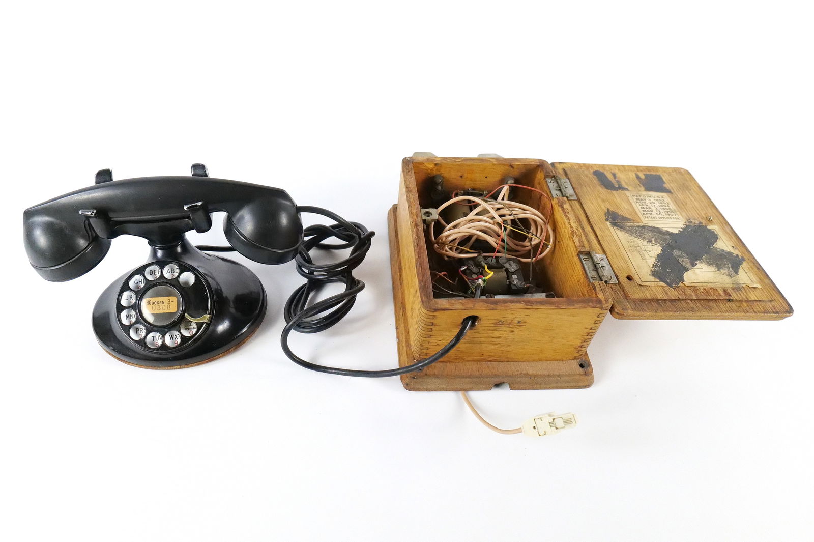 Lot of 2 Vintage and Antique Phones: Lot of 2 Vintage and Antique Phones. Including Antique Telephone Ringer Box in Solid Wooden Case and a Vintage Bell System Rotary Desk Phone. The phones are connected. The box measures 11.5" long. All