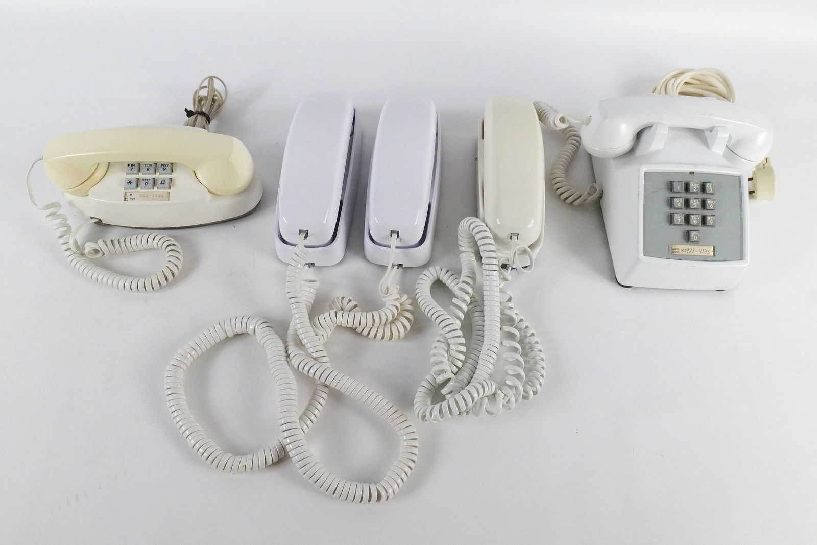 Lot of 5 Vintage Push Button White Telephones: Lot of 5 Vintage Push Button White Telephones. Including 2x AT&T Trimline Style Phones, Southwestern Bell Freedom Phone, Western Electric Princess Phone, and Western Electric Desk Phone. Some discolor