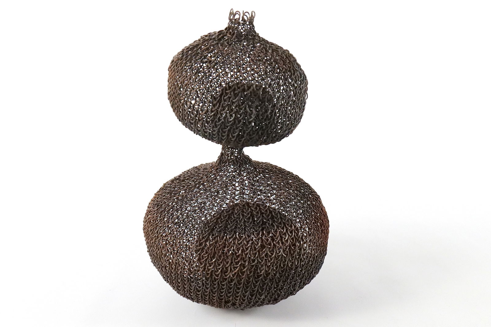Hand Woven Metal Sculpture: Hand Woven Metal Sculpture. Done by local NJ Artist. Contains a ball inside of a ball. In the manner of Ruth Asawa. Measures 12" tall x 8" wide. All invoices must be paid within 24 hours of the sale.