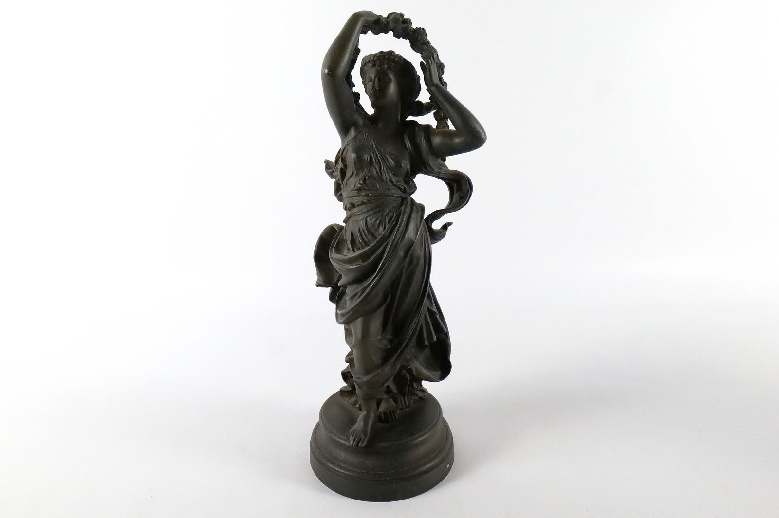 Bronze Statue of a Roman/Grecian Woman: Bronze Statue of a Roman/Grecian Woman. Appears to have been broken on one of the clothing flowing decorations and has been smoothed out at some point. Some scratching present. Measures 15.75" tall x