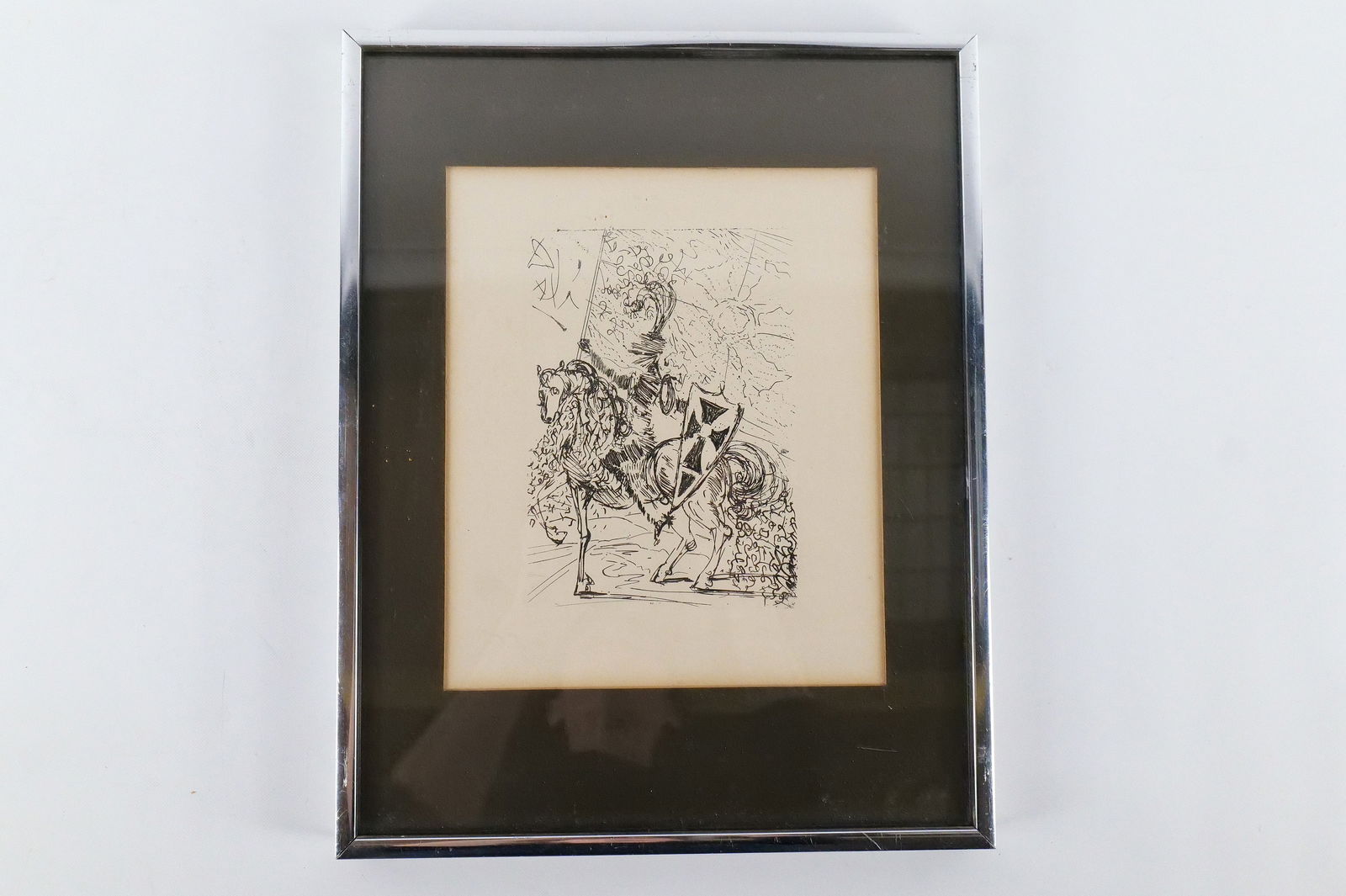 Framed Original Etching by Salvador Dali: Framed Original Etching by Salvador Dali. Entitled "El Cid". Comes with Certificate on back from The Collector's Guild. Measures 14.25" tall x 11.25" wide. All invoices must be paid within 24 hours
