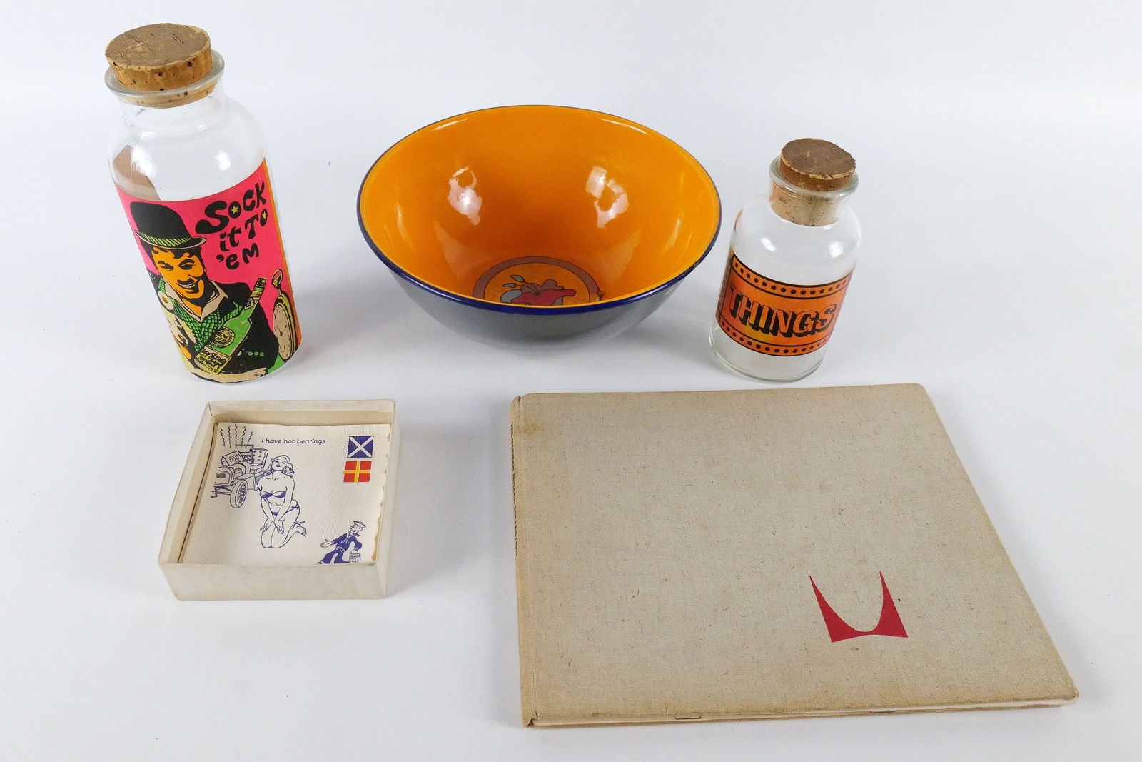 Group Lot of Collectibles: Group Lot of Collectibles. Including Peter Max Enamel Bowl - Some chipping and scratching to enamel and to the rim of the bowl, Vintage Novelty Cocktail Napkins, Vintage Novelty Apothecary Jars, and