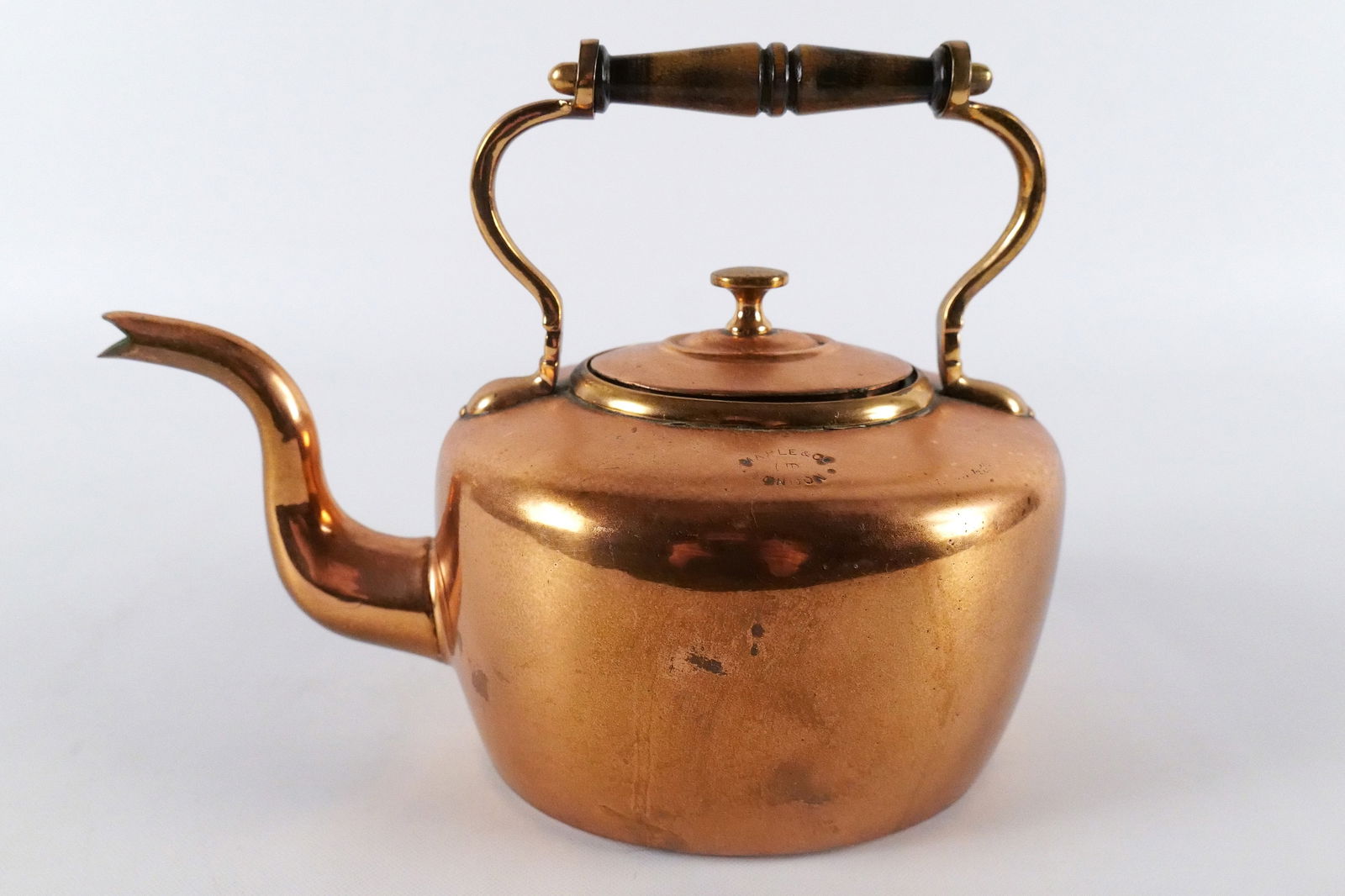 Antique Copper Tea Kettle: Antique Copper Tea Kettle. Has wooden piece on handle. Measures 7.5" tall x 9.5" wide. All invoices must be paid within 24 hours of the sale. We offer multiple shipping options, please read the shippi