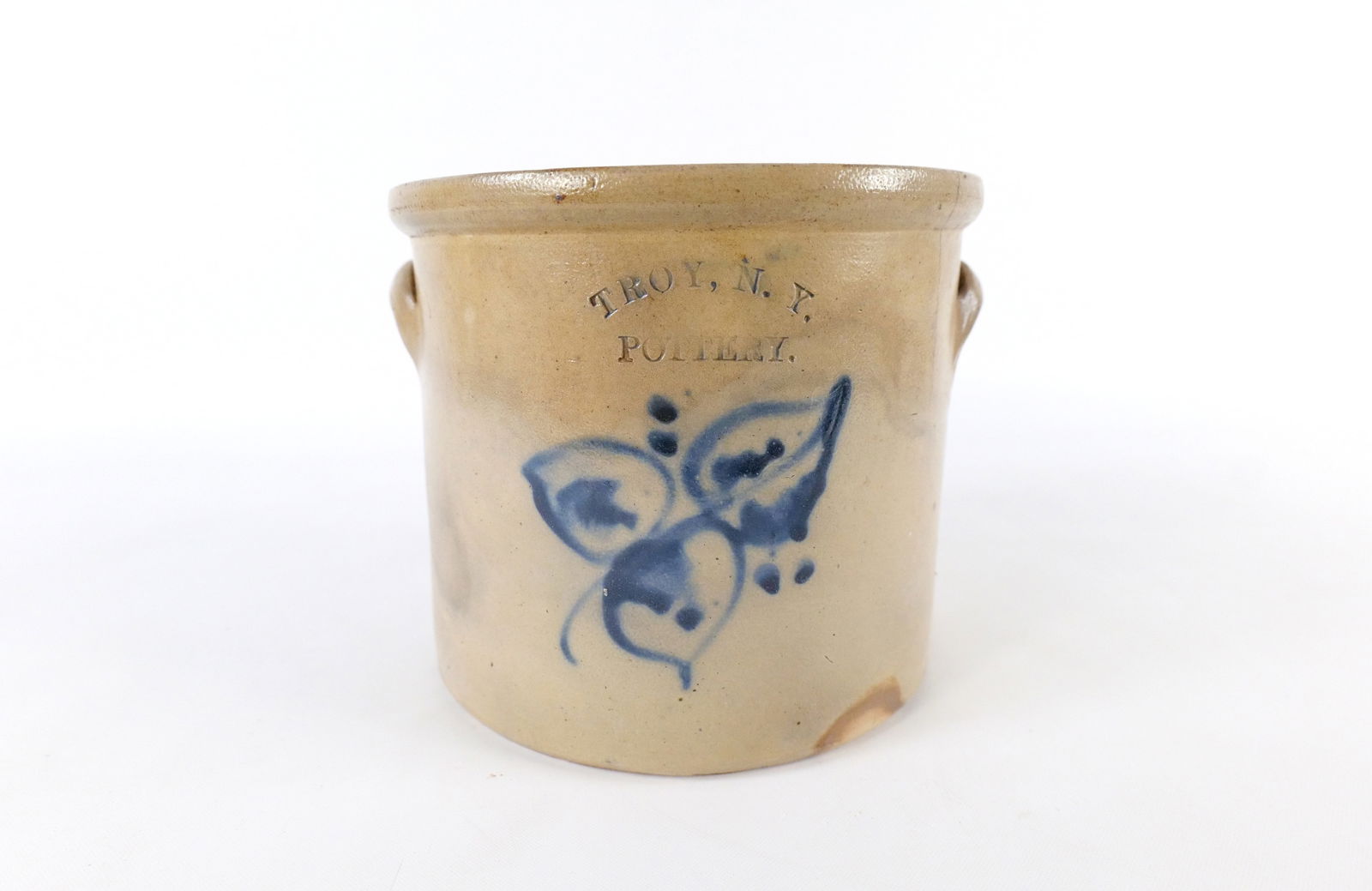 Antique Stoneware Pottery Crock: Antique Stoneware Pottery Crock. Marked Troy NY. Has Cobalt Flower Decoration. Has some hairline cracks and chipping to the rim. Measures 7.5" tall x 9.5" wide. All invoices must be paid within 24 hou